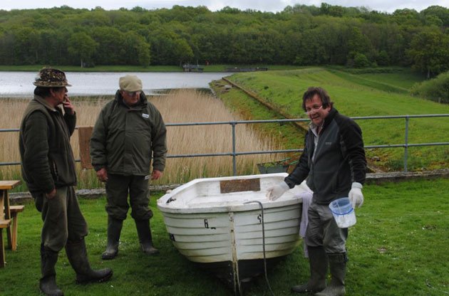 Chris Richards at work, supervised by the Bailiff and 'The Fish Monger'.