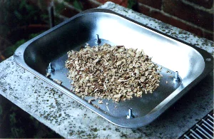 Oak chips in smoker base