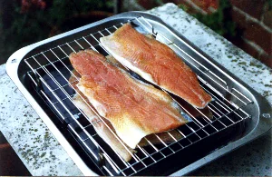 Racks loaded with trout fillets